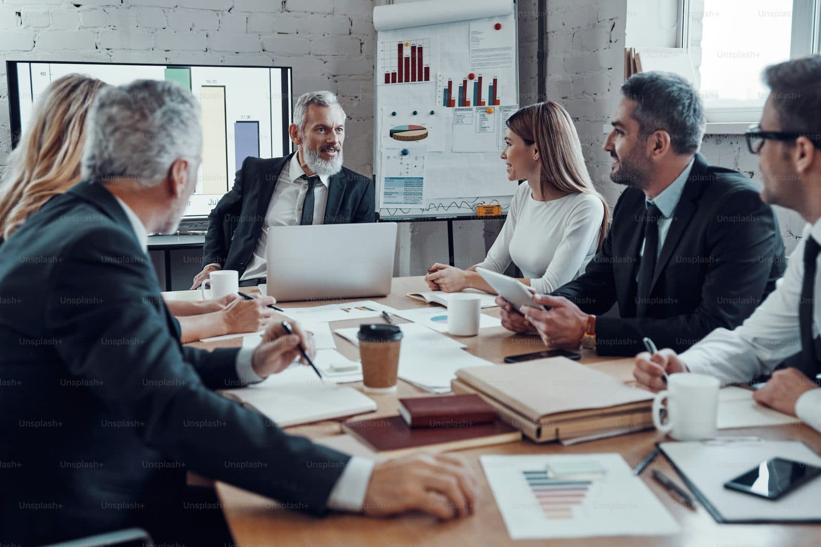 Senior leadership meeting in a corporate boardroom